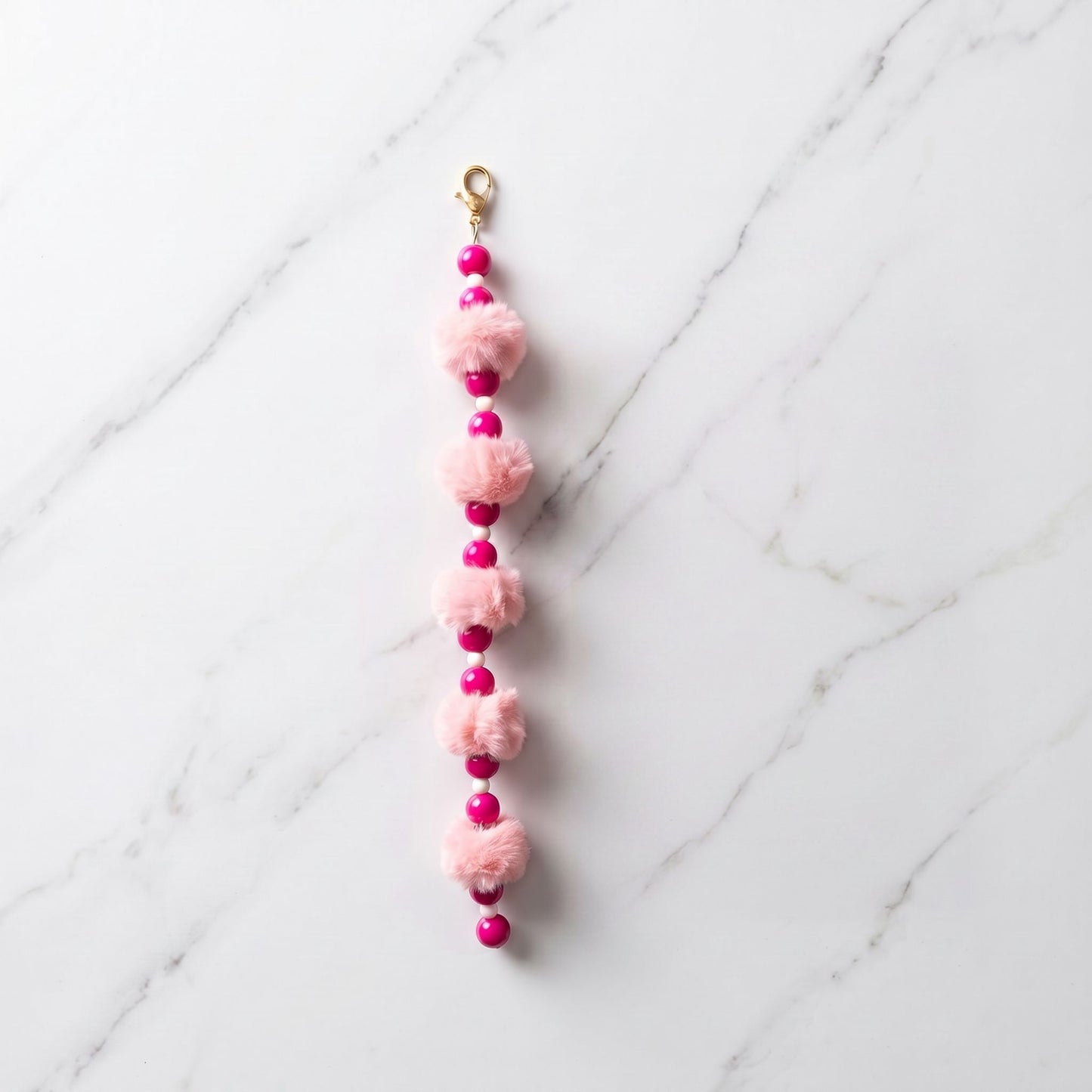 The Pink Ribbon Cloud Charm by osbina — faux fur pom poms and hot pink glass beads on white background