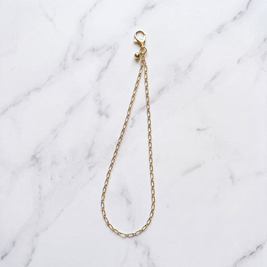 The Golden Drop - Gold Wrist Strap with Ball Charm